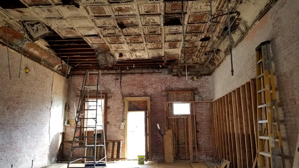 Old building with brick walls and pressed tin ceiling