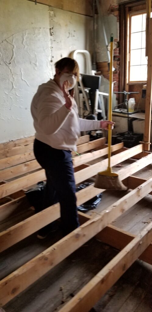 Mama Connie cleaning up the mess during our building renovation project!