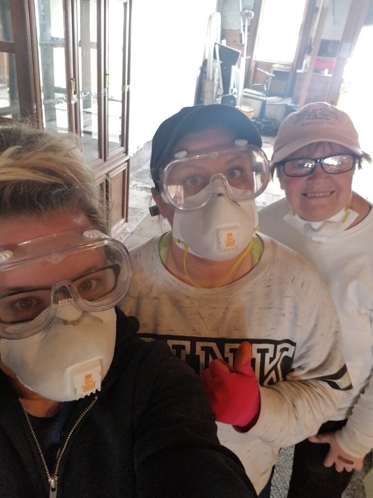 My friend Stephanie, my mom, and I posing together in masks and safety goggles