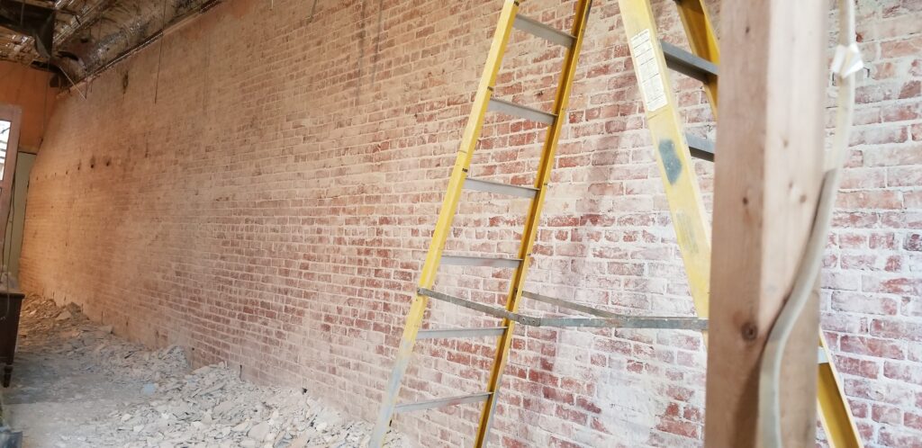 A large wall of exposed brick