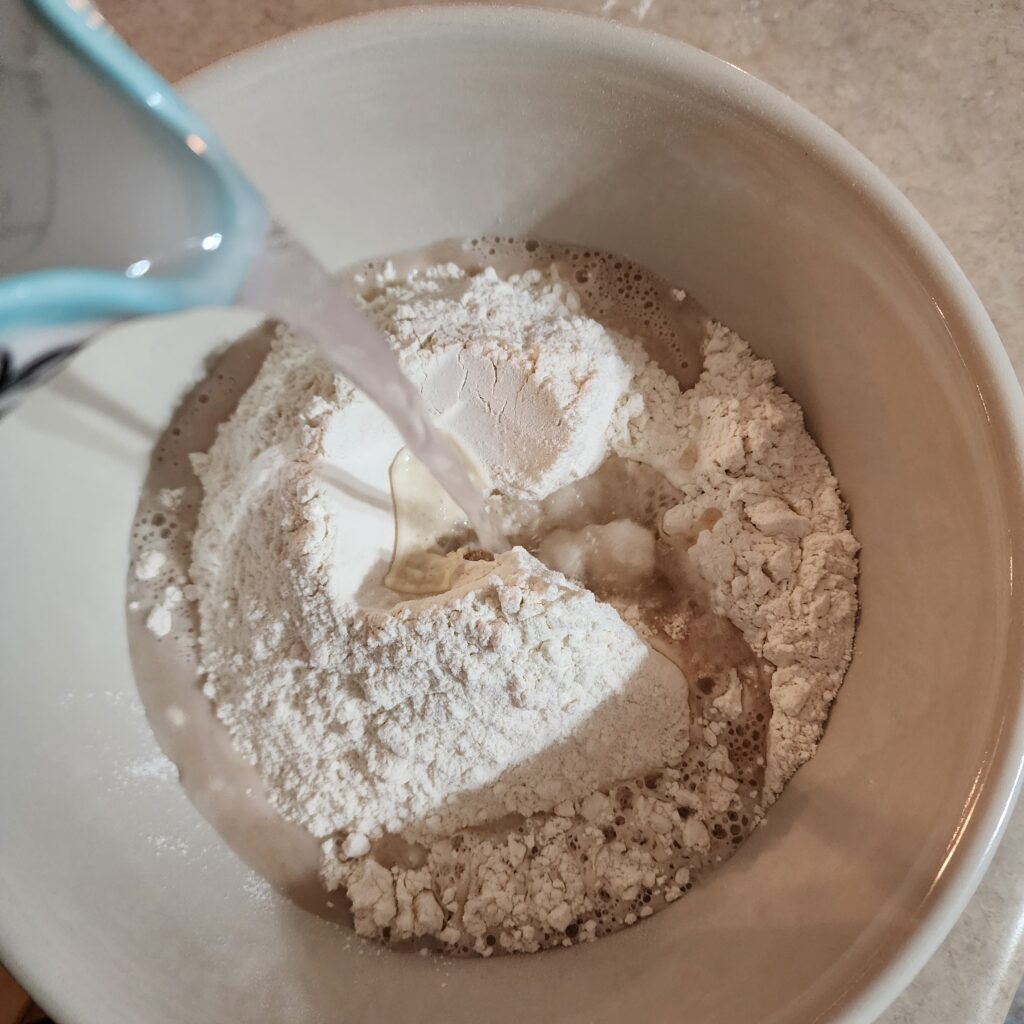 water is added to flour to create sourdough