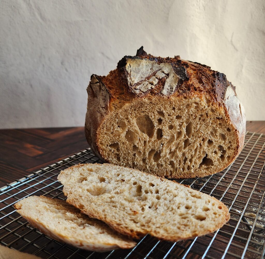 Made from scratch sourdough bread on cooling rack