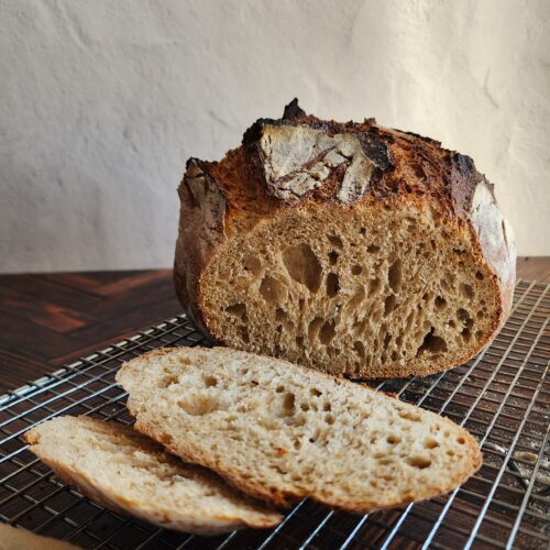 Artisan sourdough bread on cooling rack