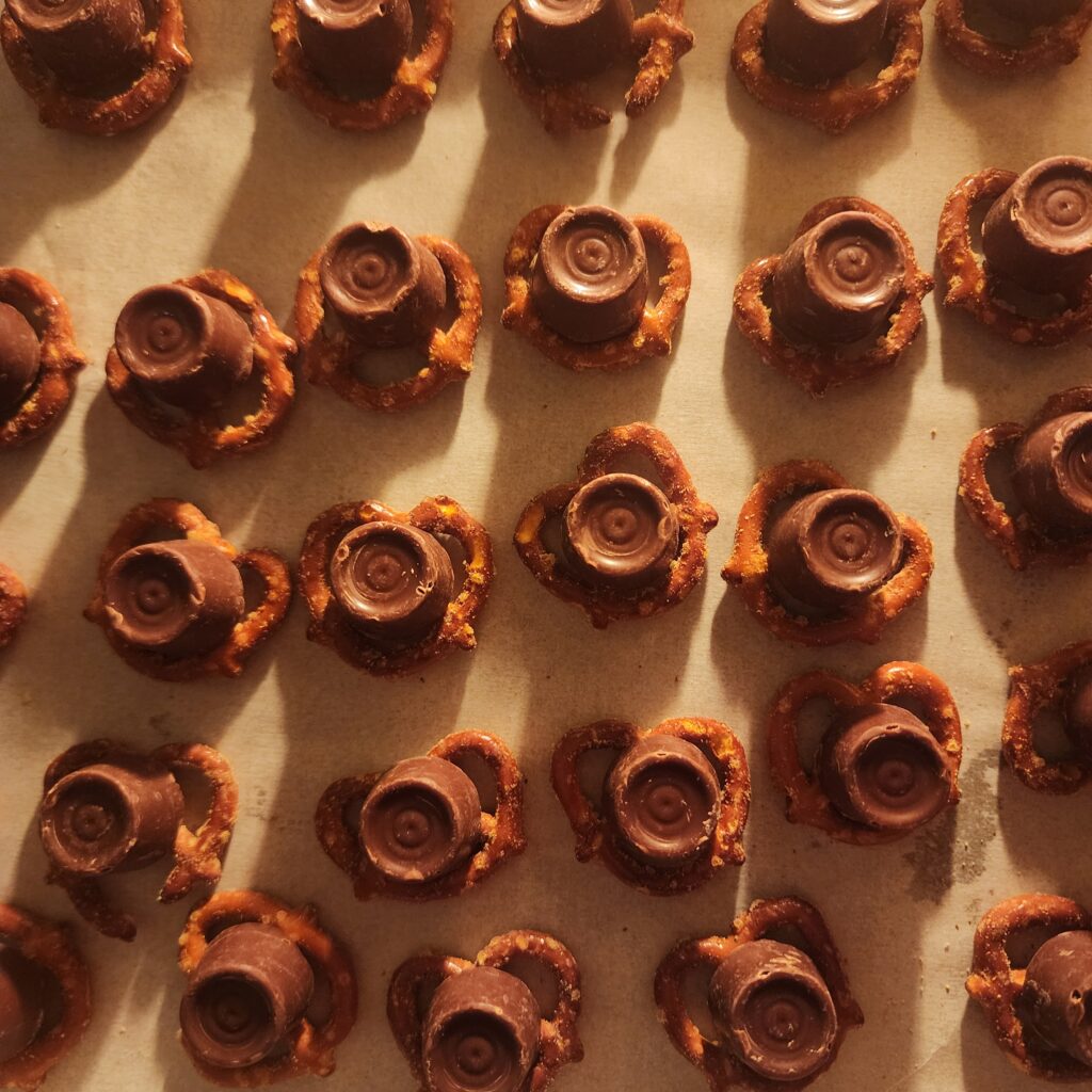 Single Rolo candies are placed on top of each pretzel