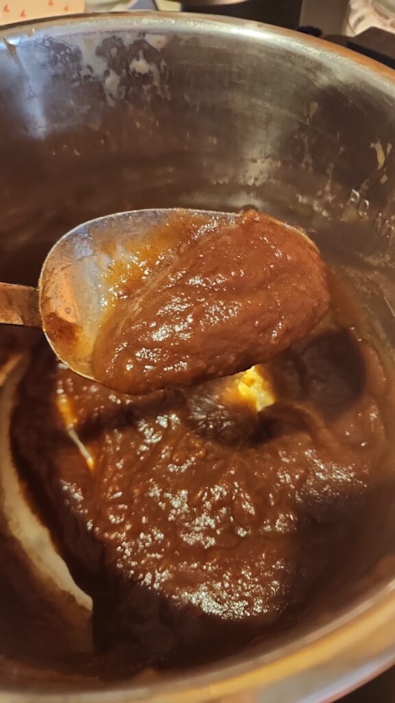 Fully cooked apple butter in spoon