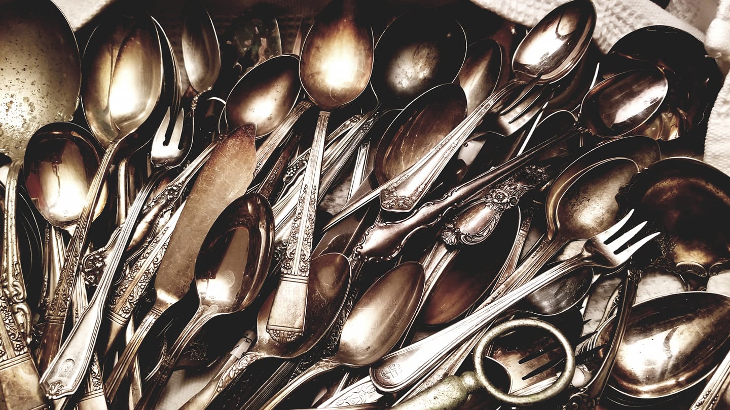 A collection of antique tarnished silverware