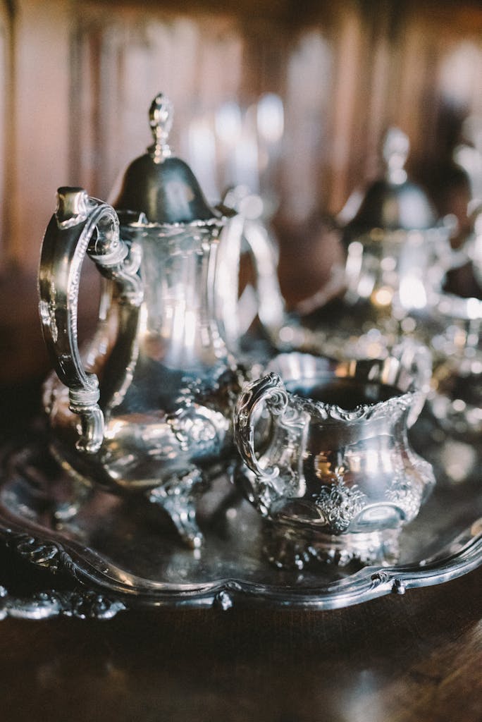 Elegant antique silver tea set showcasing intricate design and vintage charm.