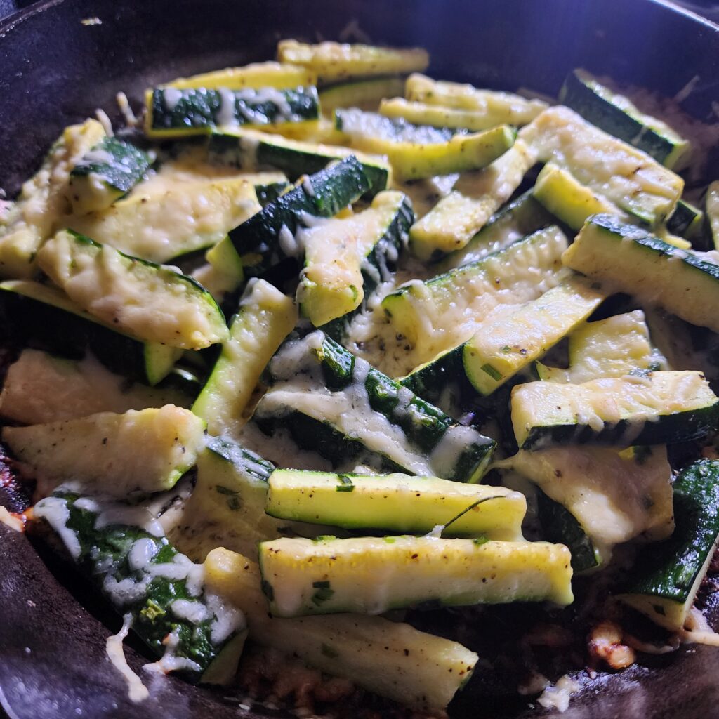 Baked Zucchini in a cast iron with herbs and Parmesan cheese