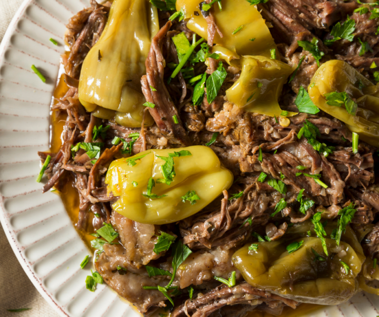 Juicy and tender Mississippi Pot Roast on a white plate