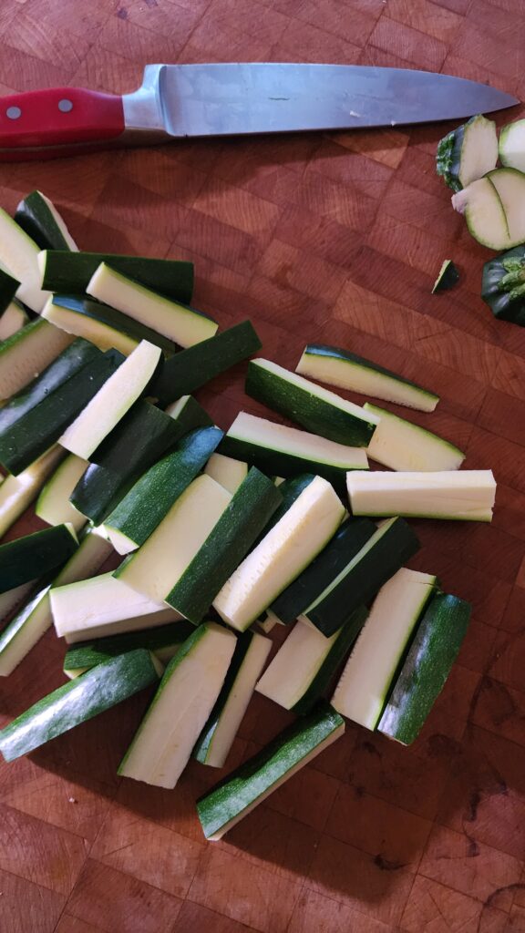 Quartered zucchini  on a butcher block