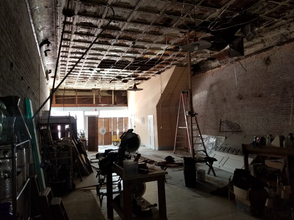 Old storefront with run down antique pressed ceiling tins