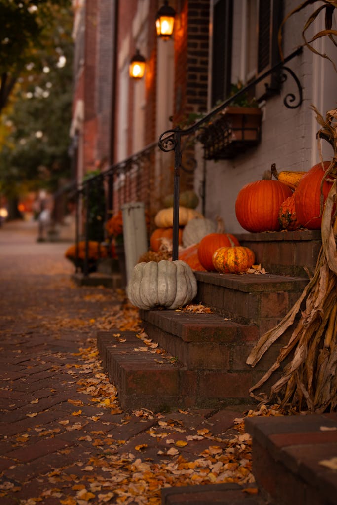Charming autumn scene with pumpkins and leaves on an urban street. Perfect fall ambiance.