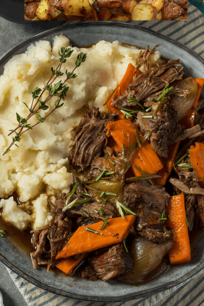 cozy pot roast with fresh thyme, mashed potatoes and roasted carrots. 