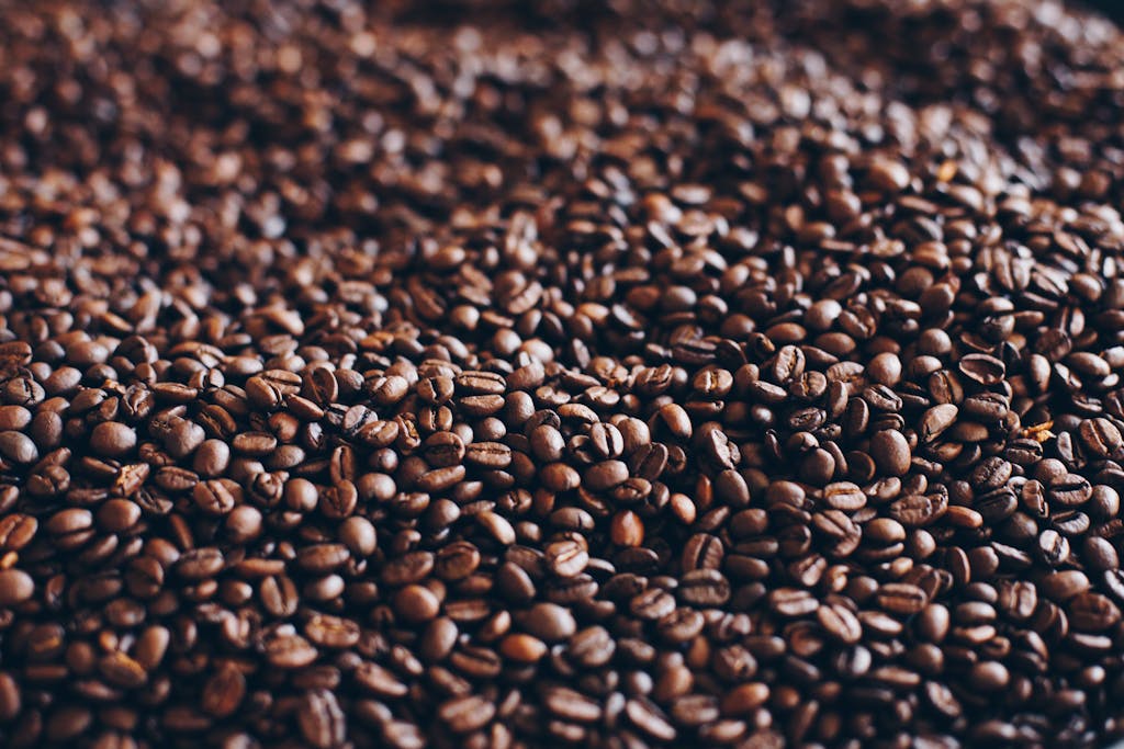 Close-up view of aromatic roasted coffee beans, perfect for caffeine lovers.