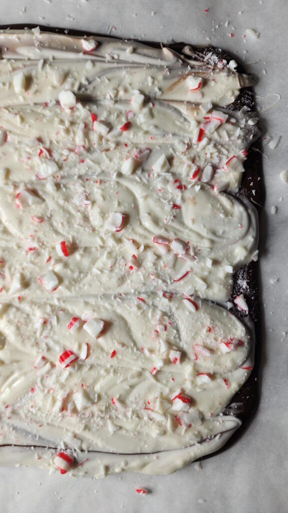 Finished Peppermint Bark candy is firming up before breaking into pieces for holiday gifting.
