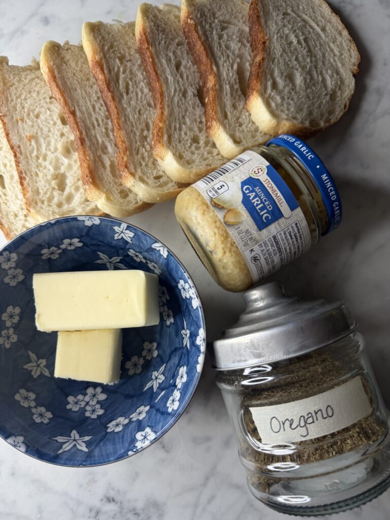 Ingredients for sourdough toast on a marble surface. 