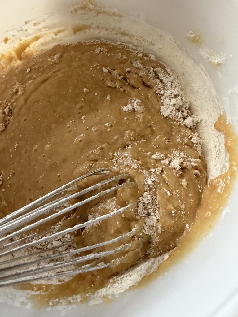 Batter being mixed to make sourdough strawberry quick bread for the perfect summer treat. 
