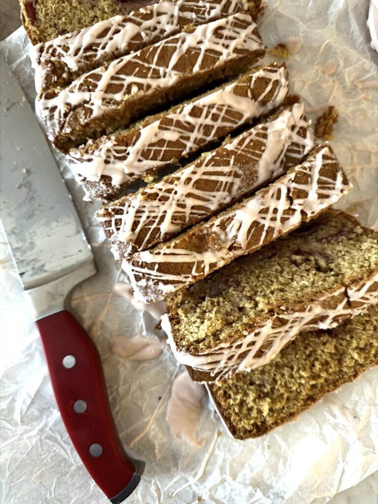 Slices of delicious and moist sourdough strawberry bread on a parchment. 