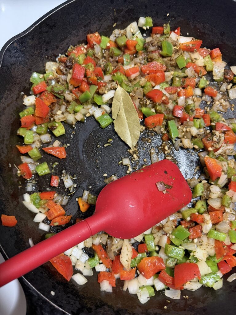 Red and Green bell peppers are sautéed together with spices and olive oil
