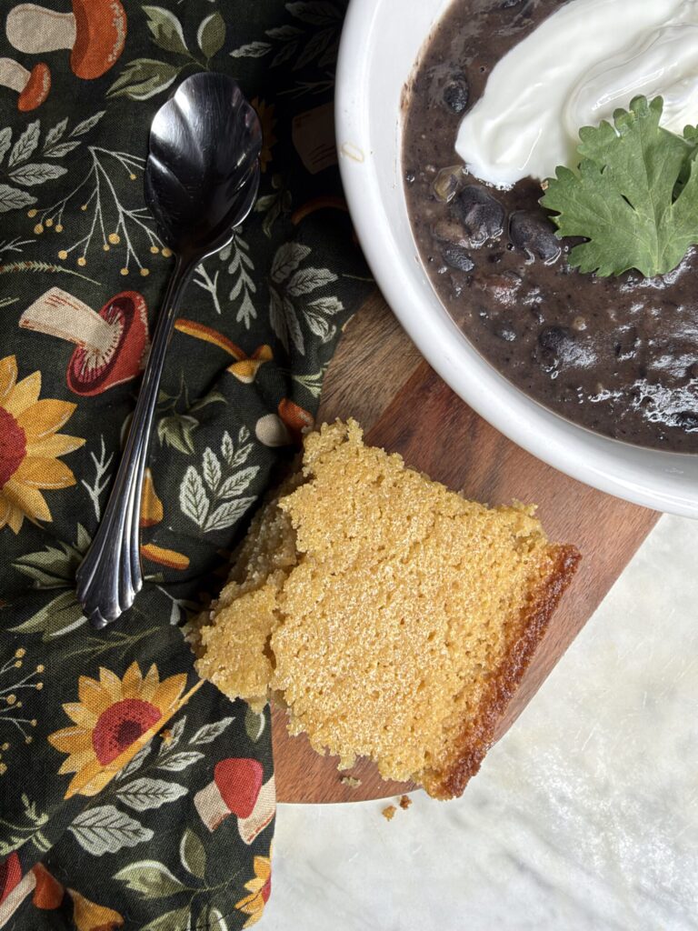 Sourdough cornbread is served alongside black bean soup