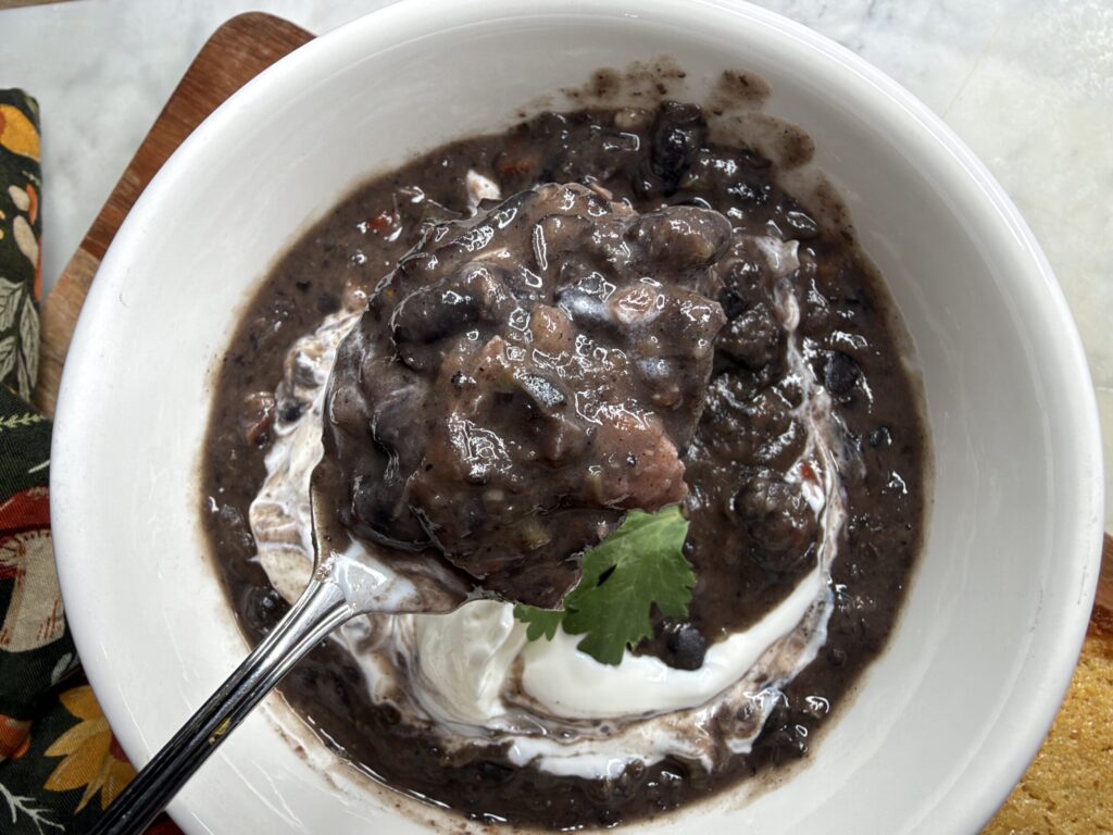 Closeup of a bite of Cuban black bean soup